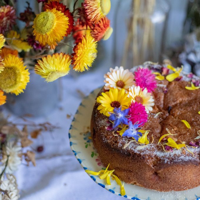 homemade apple cake decorated with edible flowers